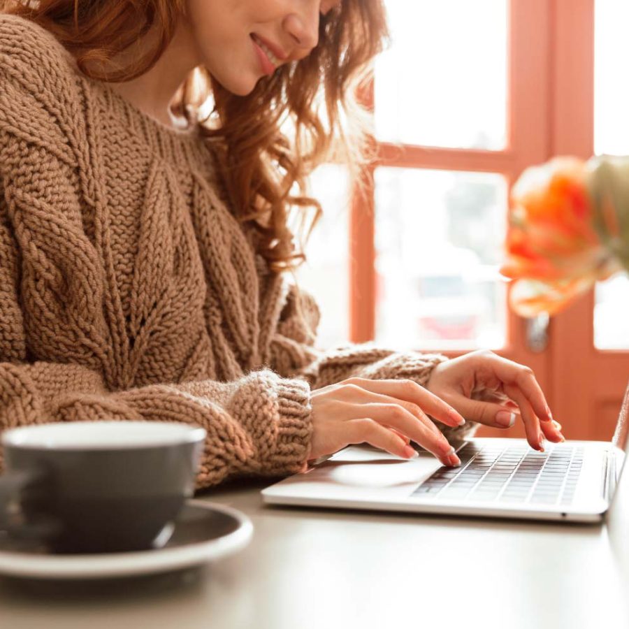 close-up-of-a-smiling-young-woman-working-AD9748H.jpg