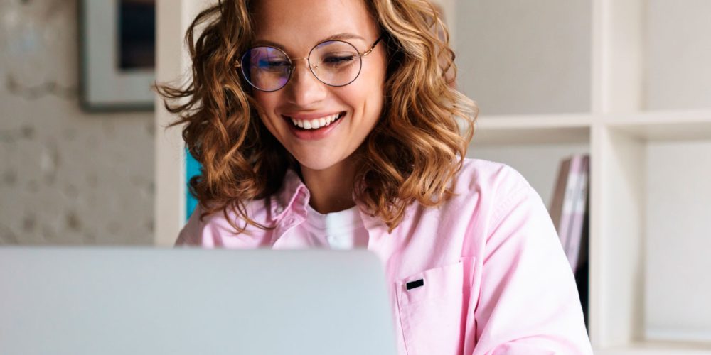 photo-of-joyful-woman-wearing-eyeglasses-smiling-a-8EUXMDJ.jpg